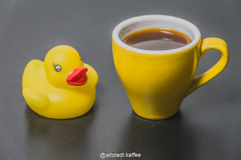 Yellow Duck Enjoys Espresso